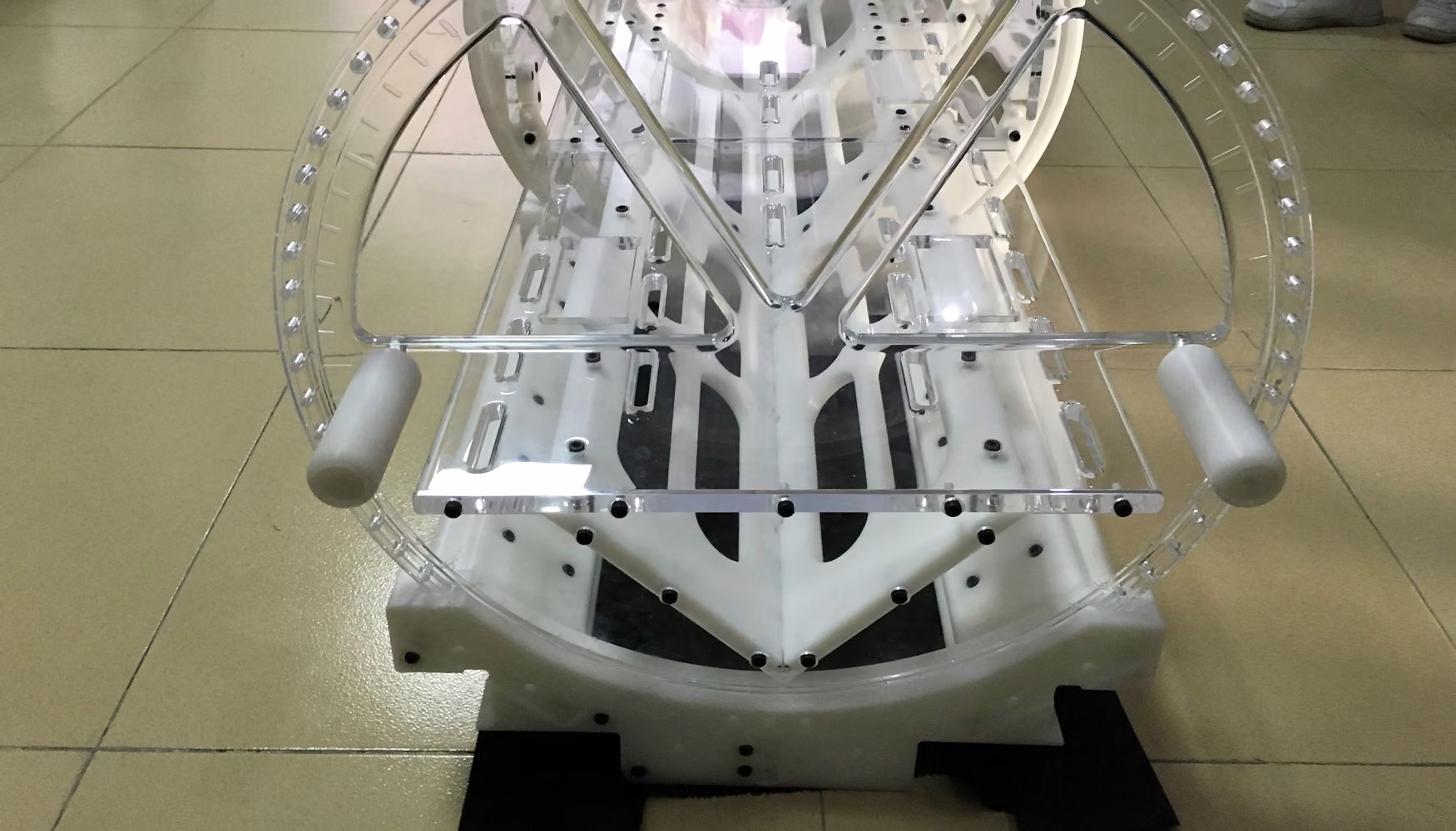 Full-scale medical device prototype assembly mounted in a transparent validation fixture