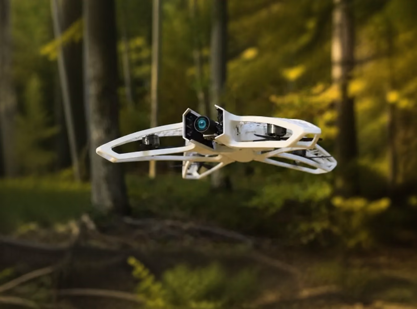 White open-frame camera drone flying outdoors in a forest
