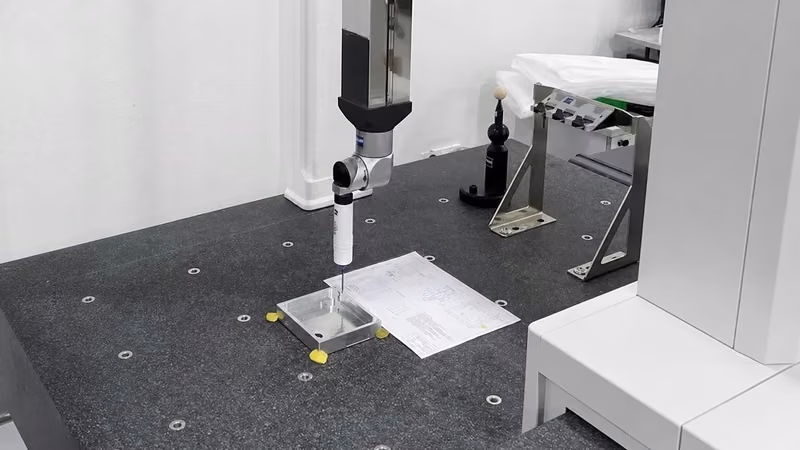 Bridge coordinate measuring machine using a tactile probe on a fixtured metal component