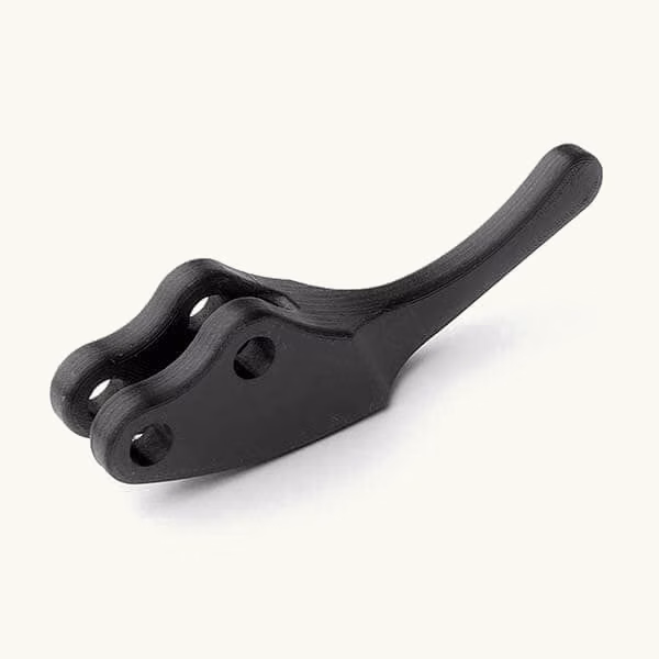 Black FDM lever with a curved handle, paired pivot openings, and a reinforced body.