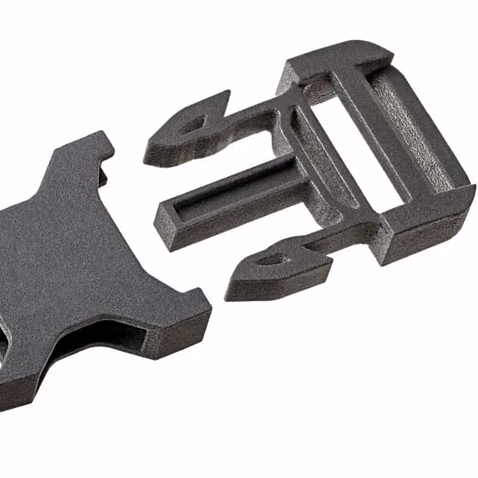 Black additively manufactured snap-fit clip and separate mating part with complementary latching features.
