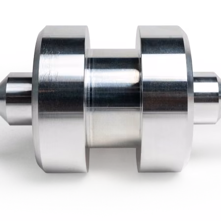 Polished precision-turned steel shaft with multiple stepped diameters and bearing surfaces.