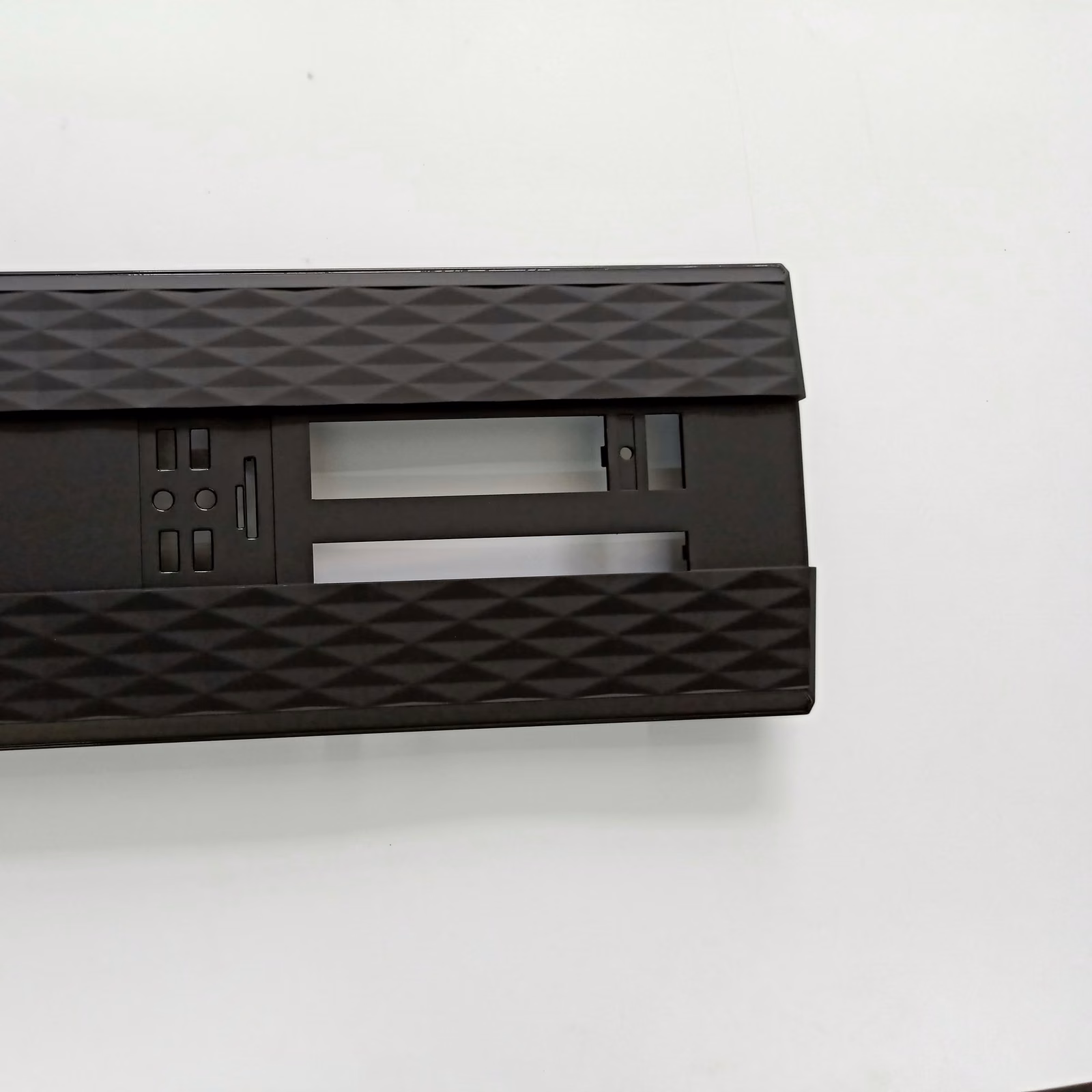 Black textured molded ABS control bezel with a wide rectangular display opening and smaller control apertures.