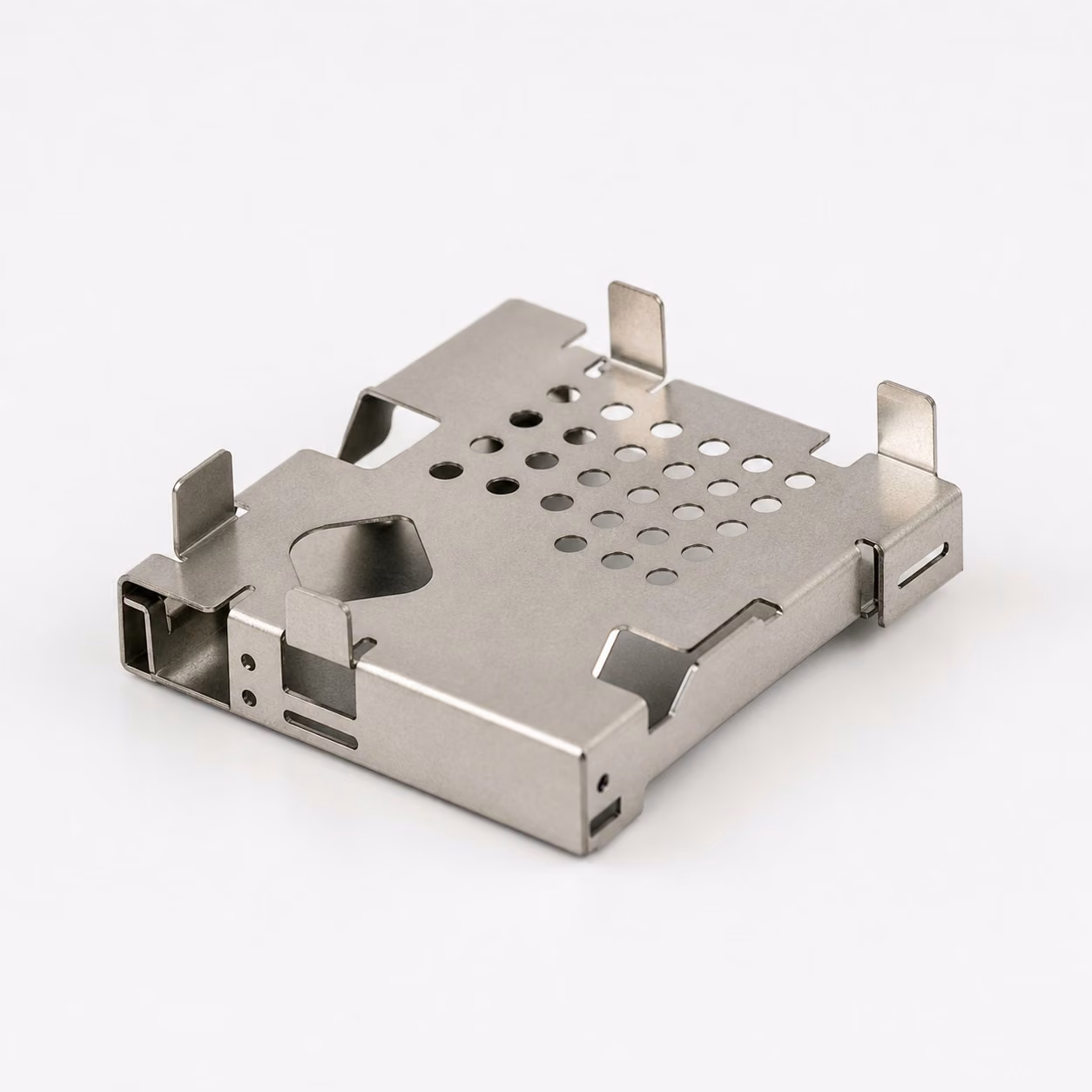 Tin-plated steel PCB EMI shield with folded contact tabs, ventilation holes, access cutouts, and board retention features.