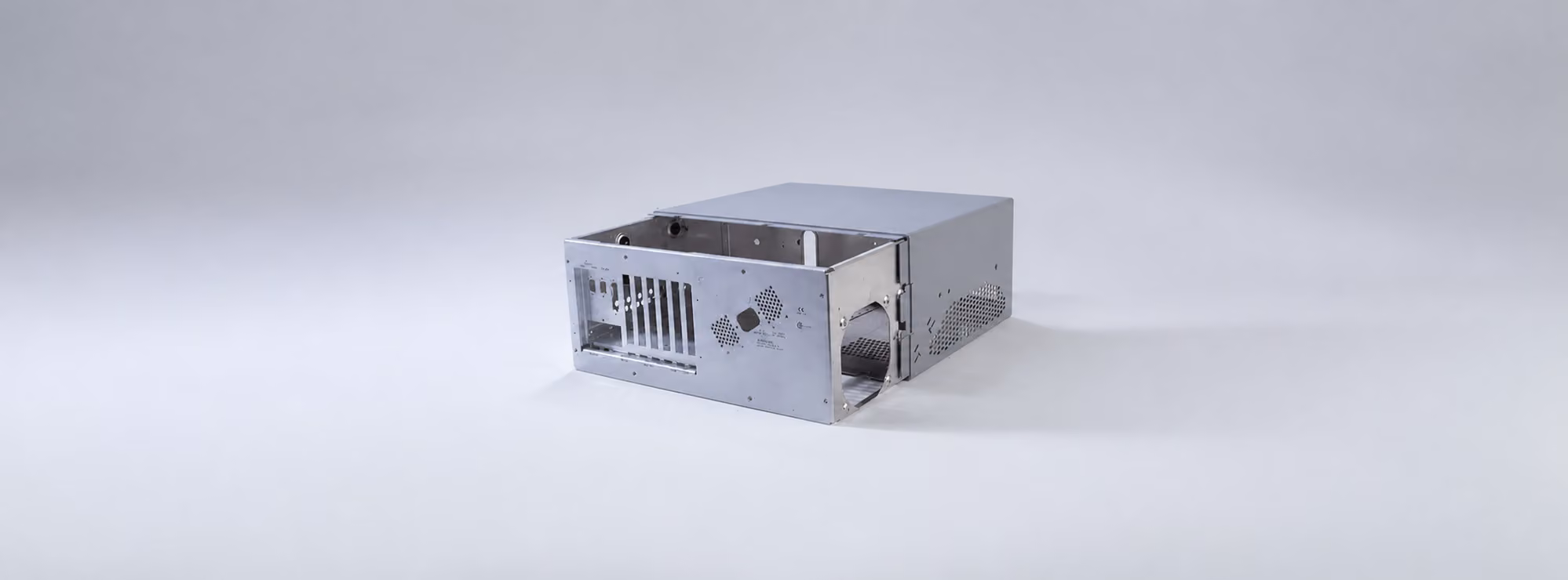 Assembled sheet-metal electronics chassis with formed panels, ventilation openings, and installed hardware